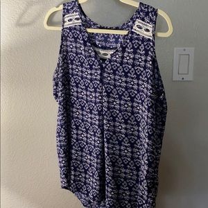 Modern, loose fitting tank with detail